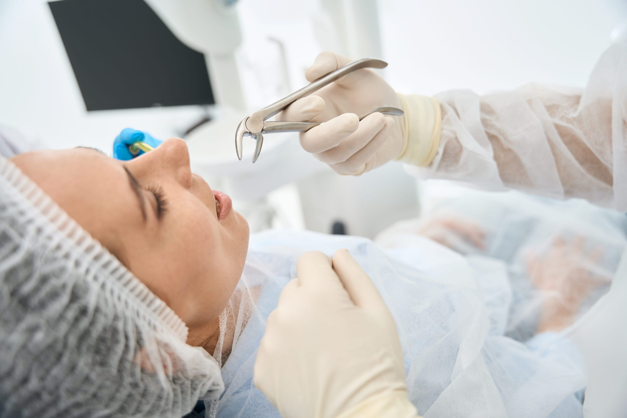 Dentist explaining signs you need a tooth extraction